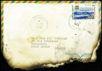Lettre brulée du Togo (7.12.79) pour Denain avec mot d'excuses des PTT du Nord "A la suite d'un incendie survenu dans un wagon transportant le courrier" + coupure de presse relative à l'incendie d'un wagon poste Paris Va